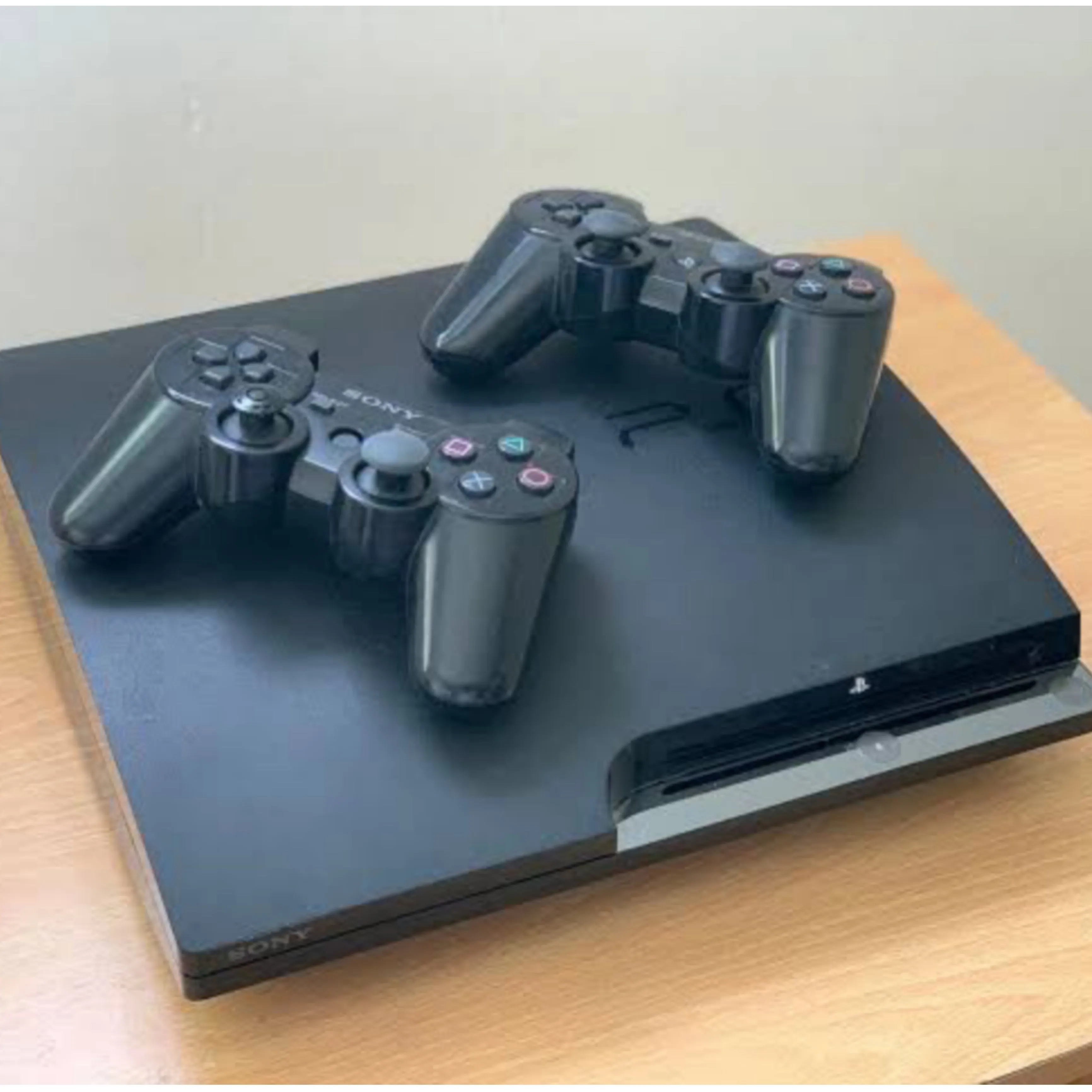 Sony Playstation 3 (PS3) Slim 160GB Game Console Complete Set with 2 DUALSHOCK Controllers and 10 Games - Foreign Used