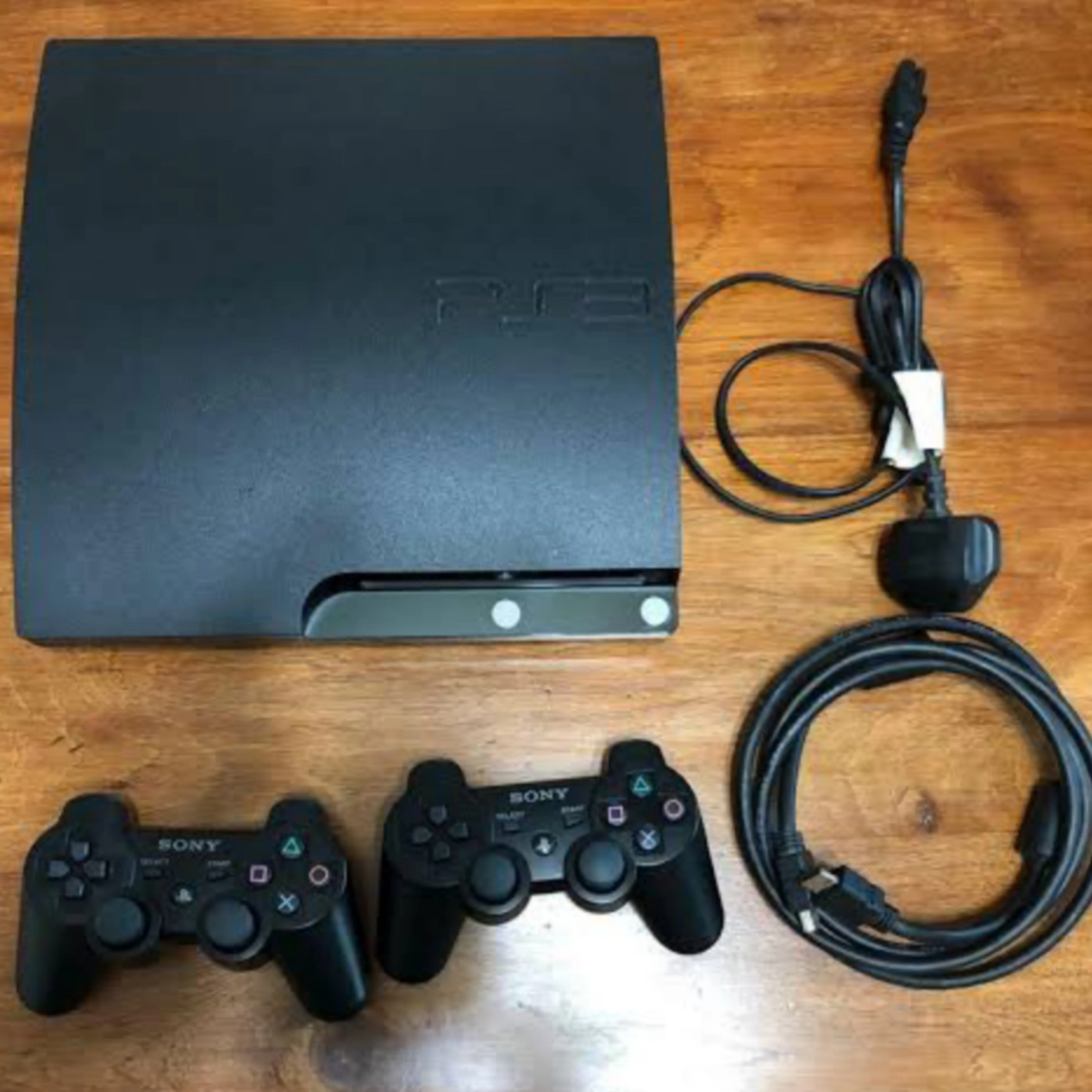 Sony Playstation 3 (PS3) Slim 320GB Game Console Complete Set with 2 DUALSHOCK Controllers and 20 Games - Foreign Used